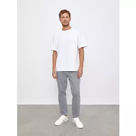 Джинсы зауженные книзу