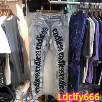 Джинсы мужские прямые рваные с вышивкой в виде ножа