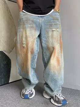 Мужские рваные джинсы с эффектом потертости