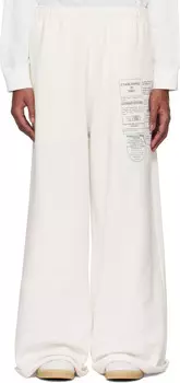 Белые спортивные штаны с газетным принтом MM6 Maison Margiela