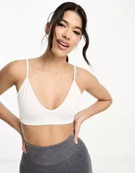 Белый бесшовный спортивный бюстгальтер с легкой поддержкой ASOS Icon