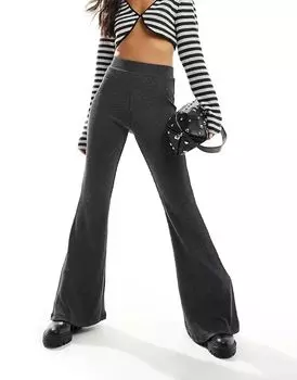 Брюки-клеш из двухцветного трикотажного полотна черного цвета Monki