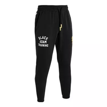 Брюки project rock black adam rival fleece pants 'black yellow' Under Armour, черный