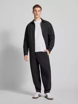 Брюки с этикеткой Tommy Jeans, черный