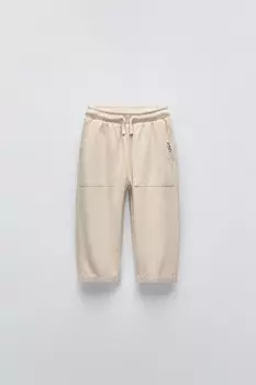 Брюки с текстурой и аппликациями-этикетками ZARA, экрю