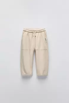 Брюки с текстурой и аппликациями-этикетками ZARA, экрю