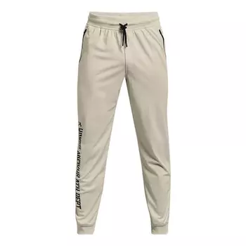 Брюки sportstyle tricot graphic pants 'beige' Under Armour, бежевый