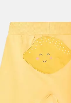 Брюки TROUSERS JOGGER PATCH AT BACK UNISEX Lindex, желтый