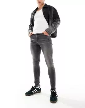 Черные эластичные джинсы ASOS DESIGN с эффектом спрея