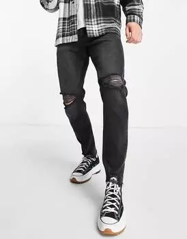 Черные эластичные зауженные джинсы с прорезами ASOS DESIGN
