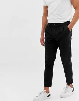 Черные брюки чинос со складками ASOS DESIGN