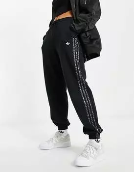 Черные джоггеры с тремя полосками и принтом под зебру adidas Originals