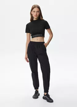 Черные женские брюки Lacoste