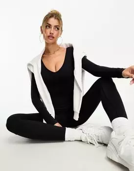 Черный бесшовный комбинезон с глубоким вырезом и длинными рукавами Missyempire