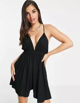 Черный пляжный комбинезон с глубоким вырезом и перекрестной спиной ASOS DESIGN