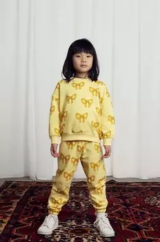 Детские спортивные брюки Mini Rodini из хлопка с бантом, желтый