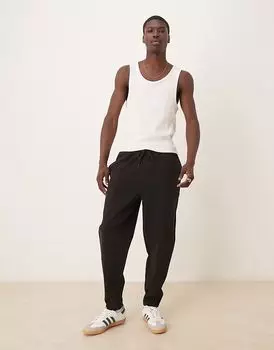 Двухсторонние зауженные книзу брюки-джоггеры ASOS DESIGN черного цвета с защипами