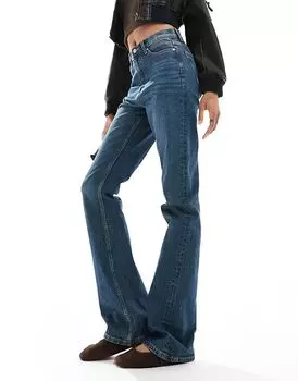 Джинсы-клеш со средней посадкой темно-синего оттенка ASOS