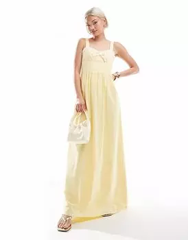Frolic - эксклюзивное макси-платье желтого цвета с вырезом в форме сердечка, контрастной отделкой воланами и бантом The Frolic