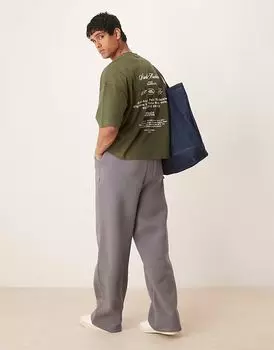 Футболка свободного кроя с заниженной линией плеч и принтом ASOS DESIGN темно-зеленого цвета