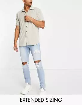 Голубые джинсы скинни средней потертости с крупными прорехами ASOS DESIGN