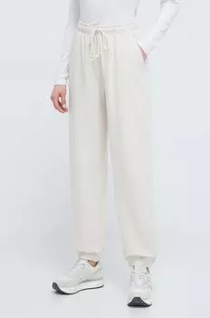 Хлопковые спортивные штаны New Balance, бежевый