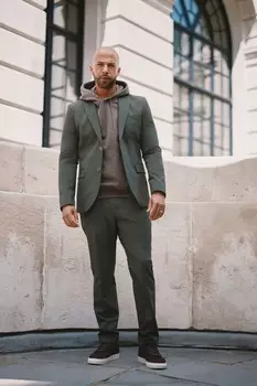 Эластичные костюмные брюки Motion Flex Next, зеленый