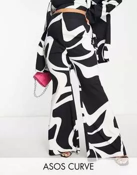 Коордные расклешенные брюки ASOS LUXE Curve с черно-белыми завитками