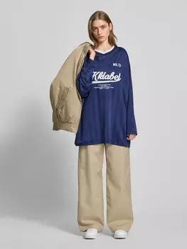 Лонгслив с этикеткой Karo Kauer