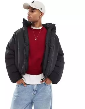 Объемный стеганый пуховик с плиссе черного цвета Bershka