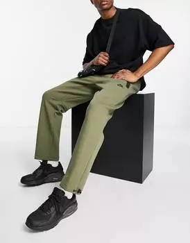 Оливковые джоггеры свободного кроя Nike Tech Fleece с пуговицами