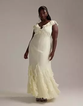 Платье макси для подружек невесты ASOS DESIGN Curve с косым кроем, пастельно-желтого цвета, с струящимися рукавами и оборчатым подолом годе