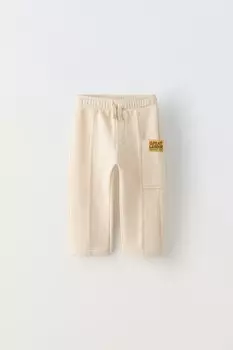 Плюшевые брюки с аппликациями-этикетками ZARA, середина экрю