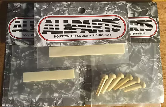 Порожек/заготовка для бриджей Fossilized Mammoth Ivory Bridge Pins - Ultimate Tone &amp; Sustain Upgrade - поставляется БЕСПЛАТНО Allparts Mammoth Ivory Bridge Pins, Nut &amp; Saddle