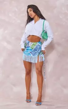 PrettyLittleThing Бирюзовая мини-юбка с кисточками и запахом на подоле в стиле пэчворк