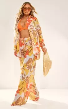 PrettyLittleThing Оранжевые фактурные широкие пляжные брюки с мятым принтом и цветочным принтом