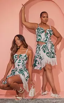 PrettyLittleThing Плюс темно-зеленая юбка с завязками на подоле и кисточками с абстрактным цветочным принтом