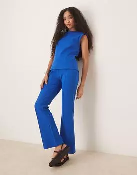 Расклешенные брюки из ткани интерлок с декоративными швами ASOS DESIGN темно-синего цвета