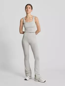 Расклешенные леггинсы с этикеткой AIMN