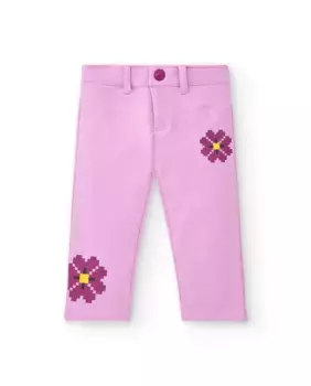 Розовые брюки для девочки с цветочными деталями Tuc tuc