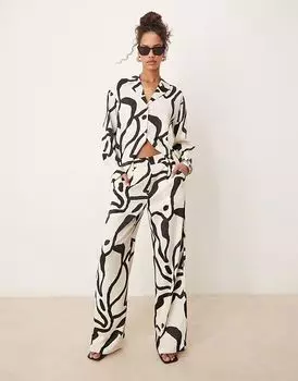 Широкие брюки AWARE из атласа с монохромным принтом