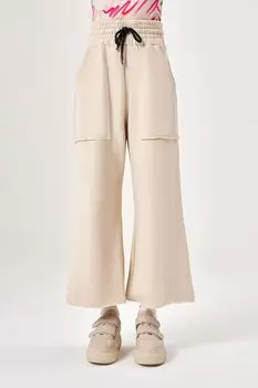 Широкие трикотажные брюки цвета экрю Mizalle