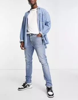 Синие зауженные джинсы средней потертости ASOS DESIGN