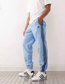 Спортивные брюки Adidas Originals Adicolor Firebird в пепельно-синем и черном цветах