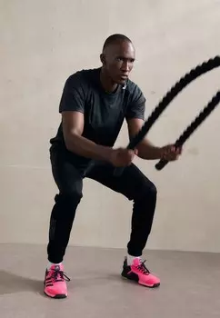 Спортивные брюки ESSENTIALS CAMOUFLAGE adidas Performance, черный