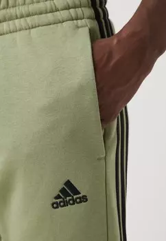 Спортивные брюки ESSENTIALS TAPERED CUFF 3 STRIPES PANTS adidas Sportswear, зеленый