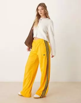 Спортивные брюки Firebird желтого цвета adidas Originals