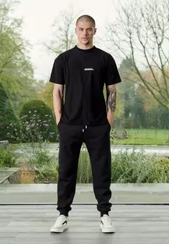 Спортивные брюки HERMAN&CO, черный