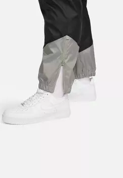 Спортивные брюки Nike, черные темные лепнины Saturn gold