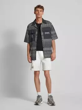 Спортивные шорты классического кроя с эффектной нашивкой KARL KANI, синий